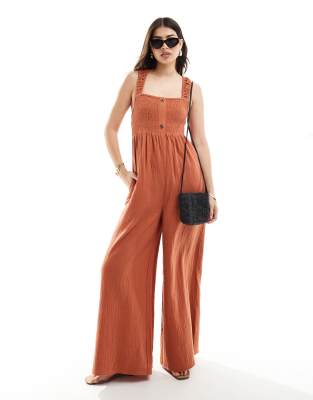 Asos Design Shirred Bodice Jumpsuit With Elastic Straps In Rust In Red