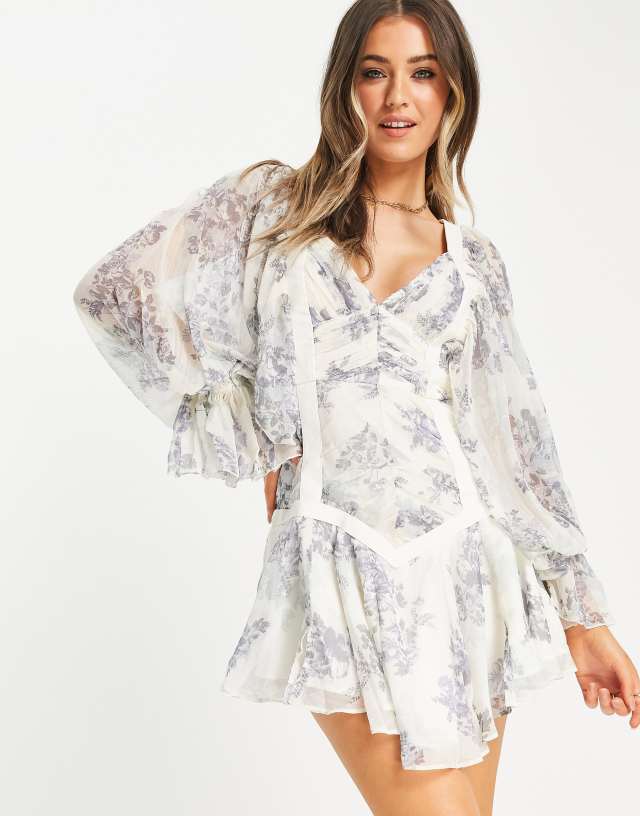 ASOS DESIGN shirred mini dress with PU tape detail in floral print