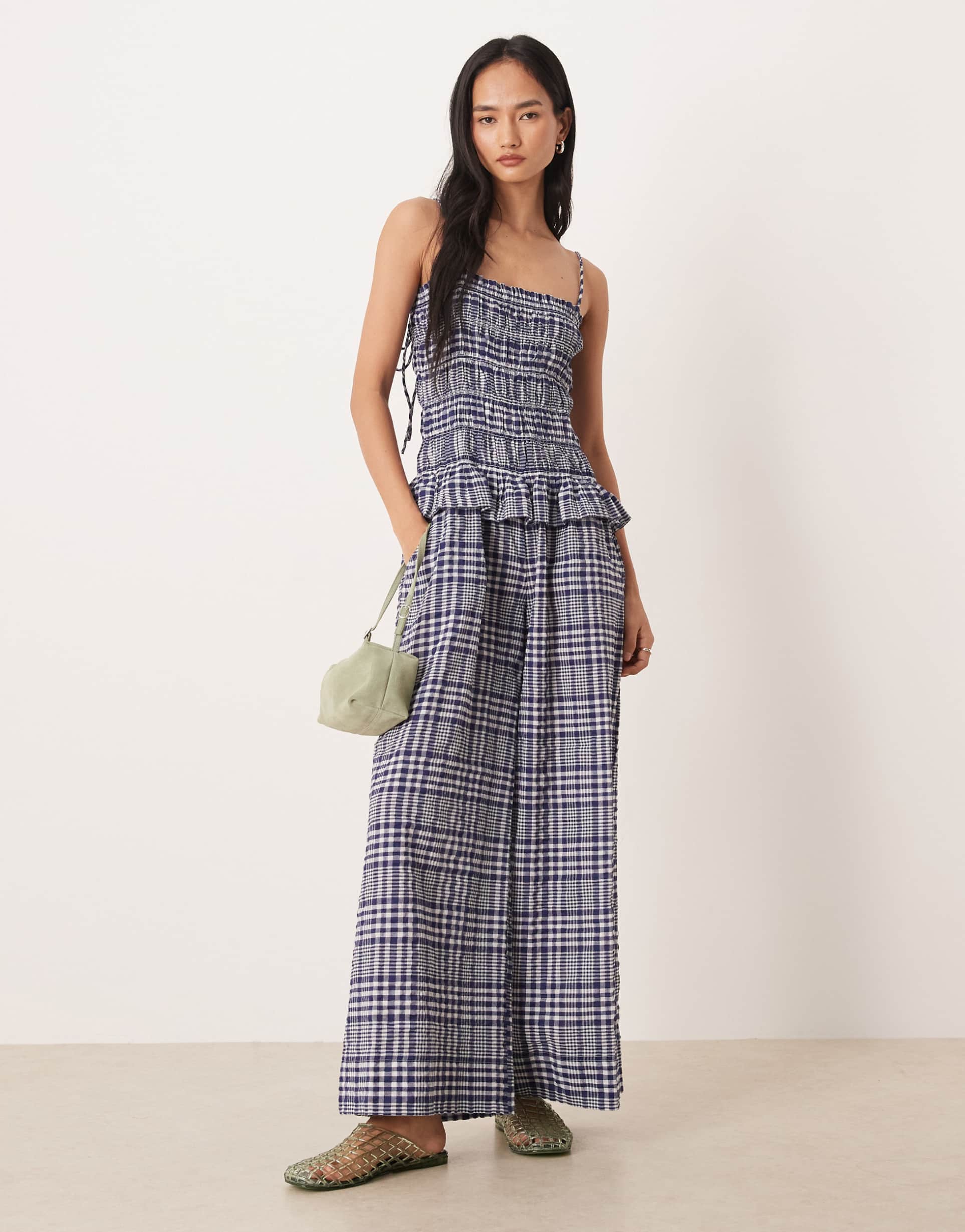 asos design shirred peplum jumpsuit in navy gingham