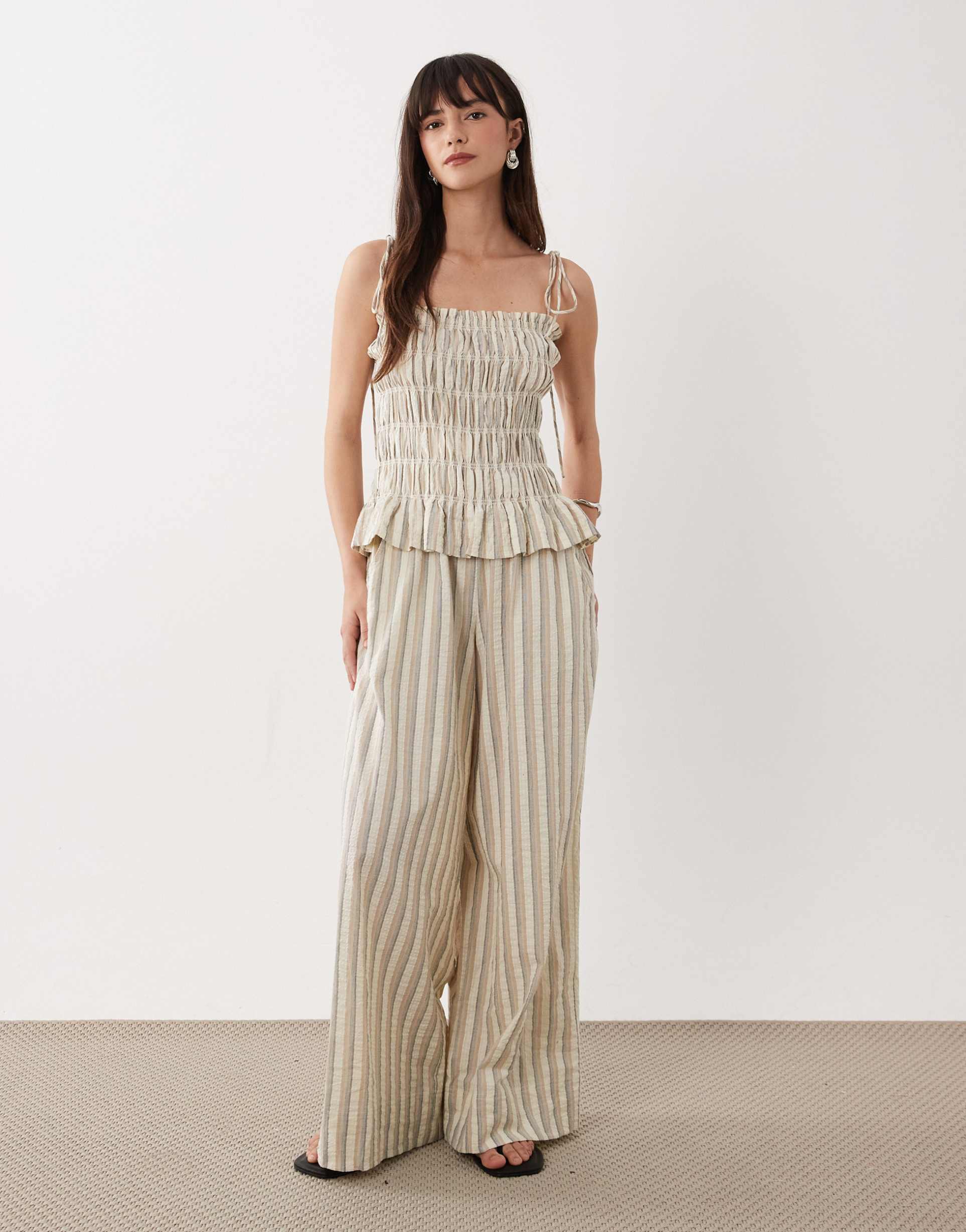 asos design shirred peplum jumpsuit in neutral stripe