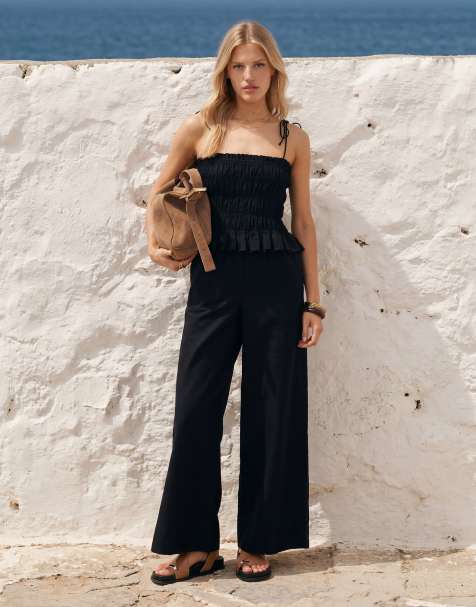 ASOS DESIGN shirred peplum waist jumpsuit in black - view 1
