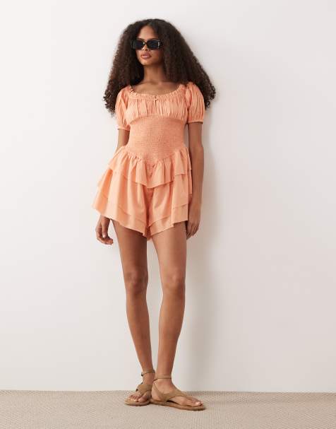 ASOS DESIGN shirred playsuit with ruffle shorts in coral - view 1