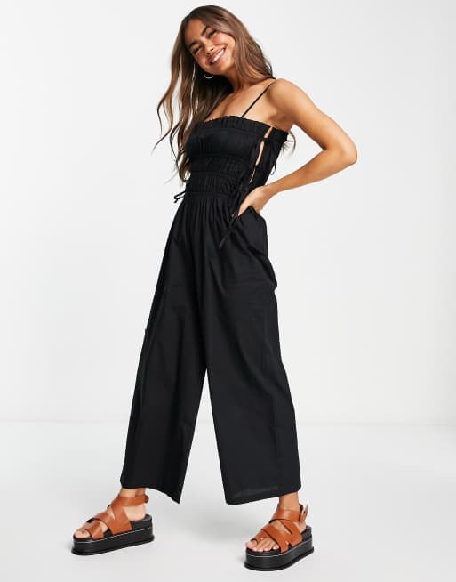 ASOS DESIGN shirred strappy jumpsuit with tie side detail in black