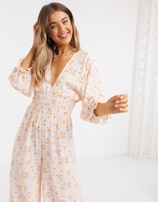 ASOS DESIGN shirred waist jumpsuit in meadow floral print