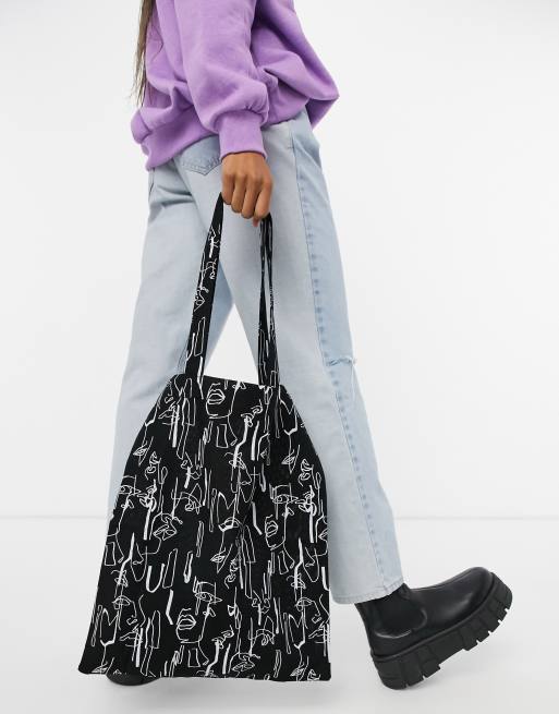 ASOS DESIGN - Shopper grande in cotone con stampa di volto astratto