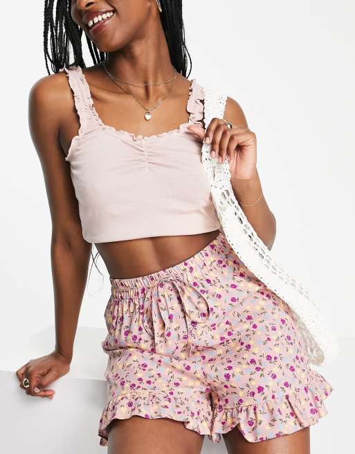 ASOS DESIGN - Short à taille élastique et ourlet à volants - Rose à fleurs