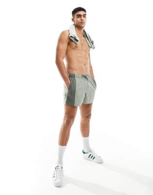 ASOS DESIGN swim shorts in short length with tonal panel design in khaki - ASOS Price Checker