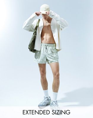 ASOS DESIGN swim shorts in short length with camo print in khaki  - ASOS Price Checker