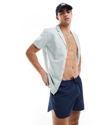 ASOS DESIGN swim shorts in short length with thin waistband in navy - ASOS Price Checker
