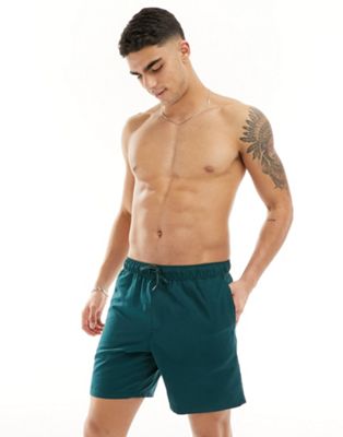 ASOS DESIGN swim shorts in mid length in forest green - ASOS Price Checker