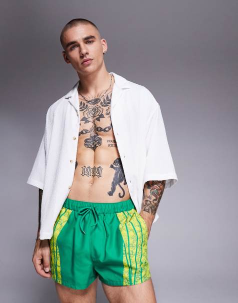 ASOS DESIGN - Short de bain ultra court avec imprimé animal placé - Vert - view 1