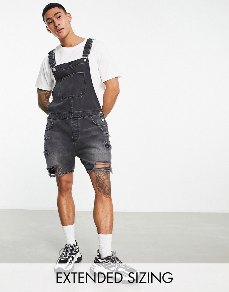ASOS DESIGN short denim dungaree in washed black with heavy rips