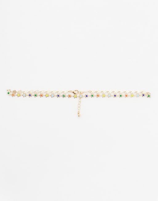 ASOS DESIGN short drop choker necklace with daisy detail in gold tone