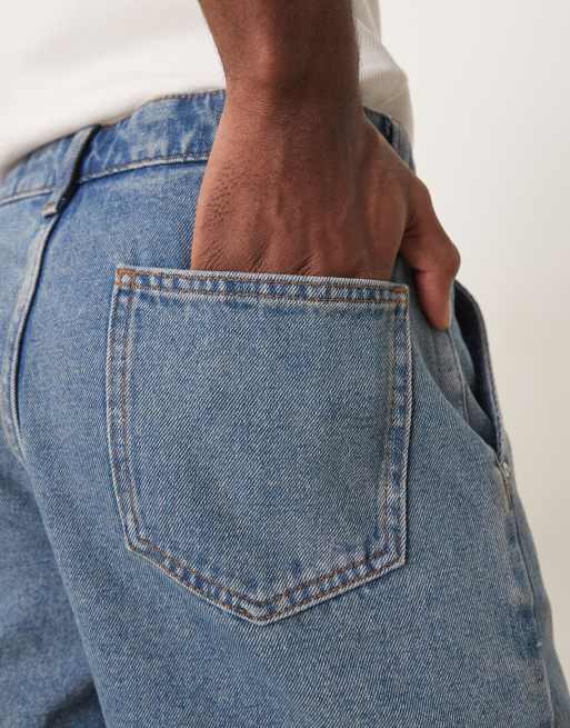 ASOS DESIGN short length slim denim shorts with pleats in mid wash blue, 4 of 5