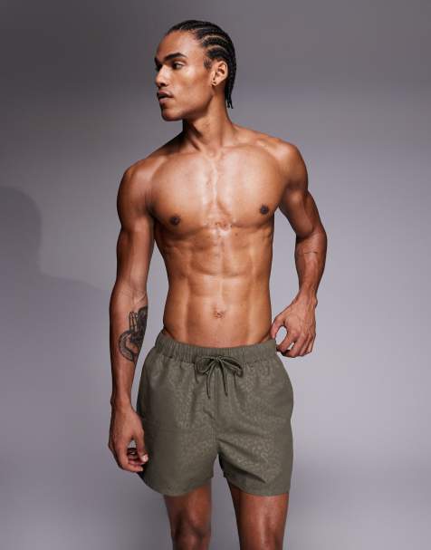 ASOS DESIGN short length swim shorts in khaki-green leopard jacquard - view 1