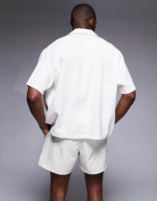 ASOS DESIGN short length swim shorts with floral print in cream