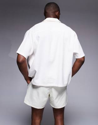 ASOS DESIGN short length swim shorts with floral print in cream