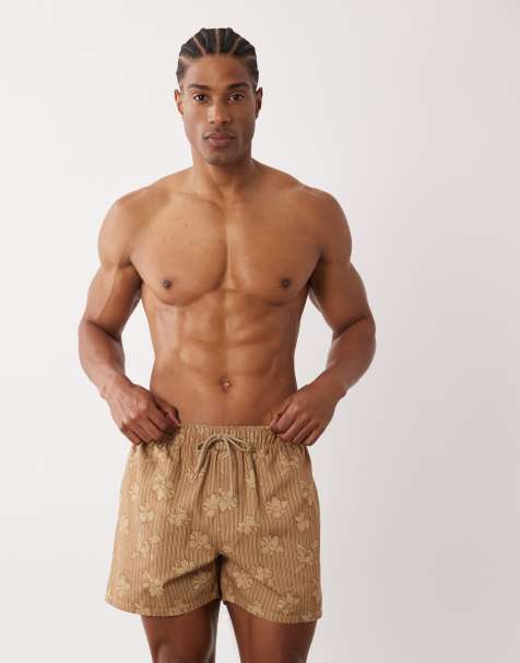 ASOS DESIGN short length swim shorts with floral striped print in brown - view 1