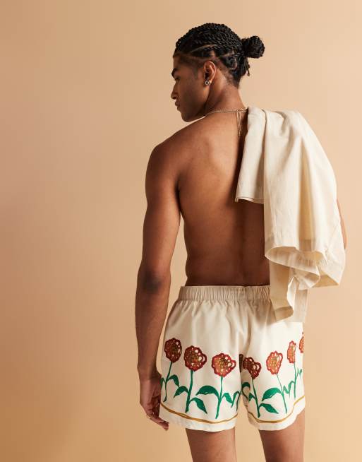 ASOS DESIGN short length swim shorts with flower prints in stone