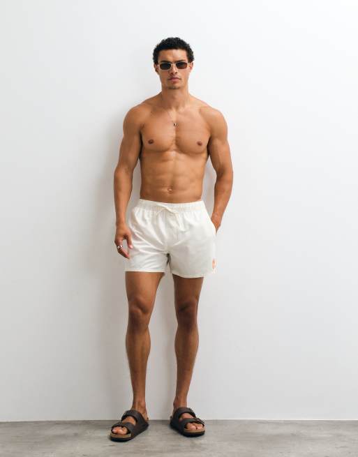 ASOS DESIGN short length swim shorts with silicone placement print in cream, 2 of 5