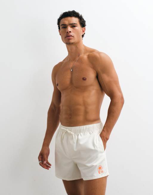 ASOS DESIGN short length swim shorts with silicone placement print in cream, 5 of 5