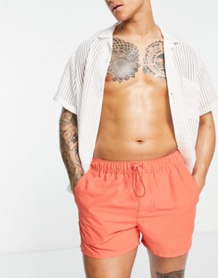 ASOS DESIGN short length swim shorts with toggle in red