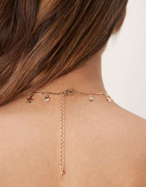 ASOS DESIGN short necklace in wavy design with small sea-life charms in gold tone, 3 of 3