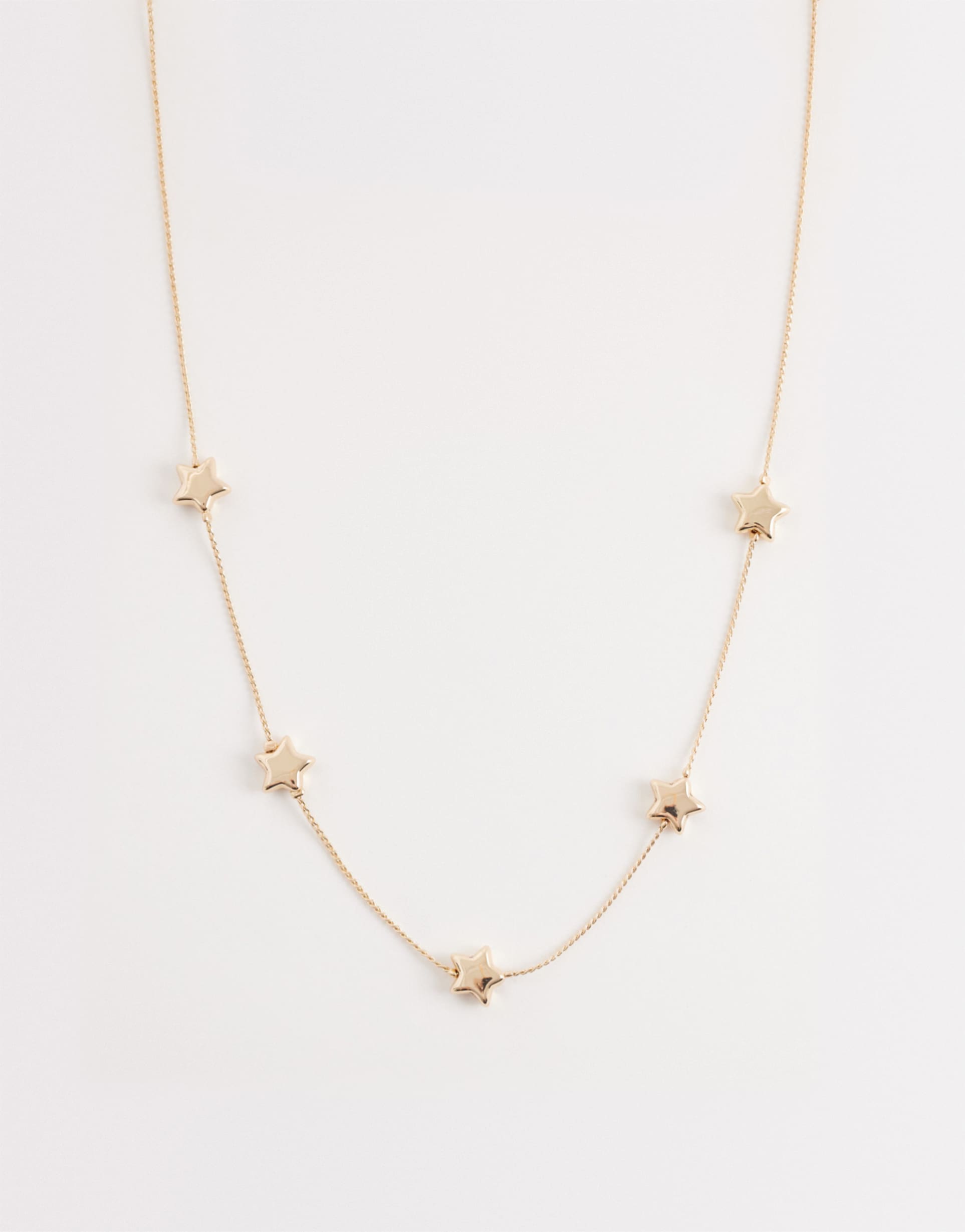 asos design short necklace with puffy star design in gold tone