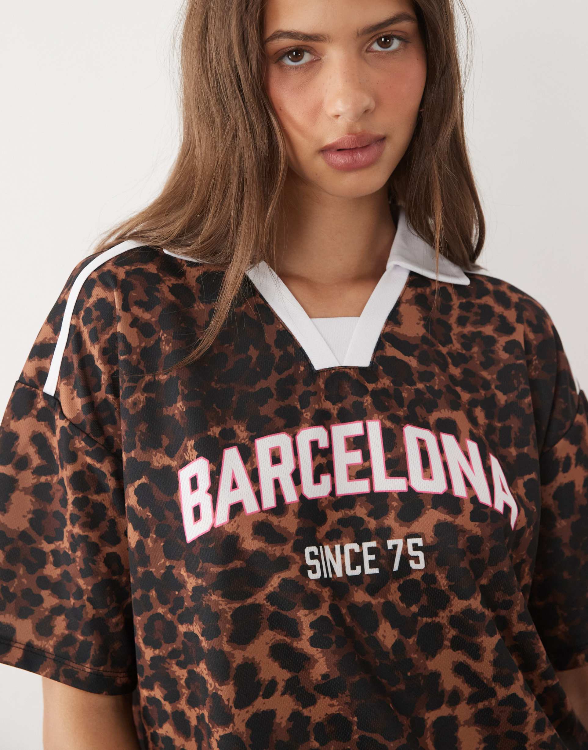 asos design short sleeve oversized top in leopard print with graphic