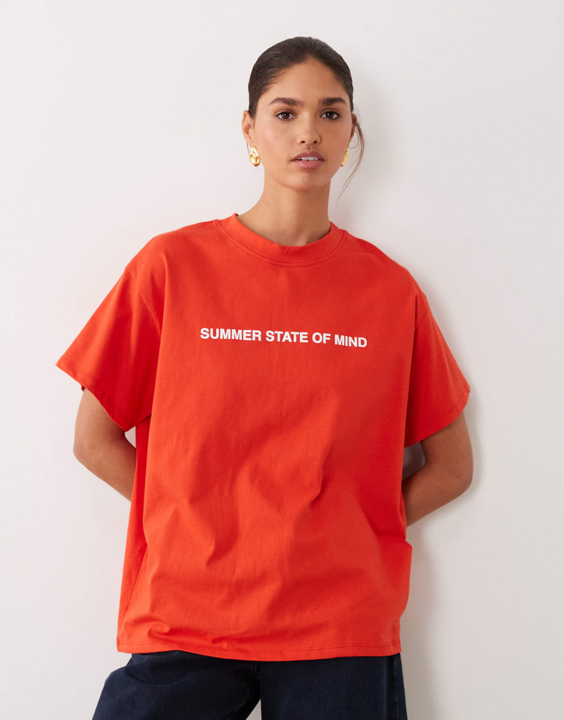 asos design short sleeve oversized top with slogan print in red