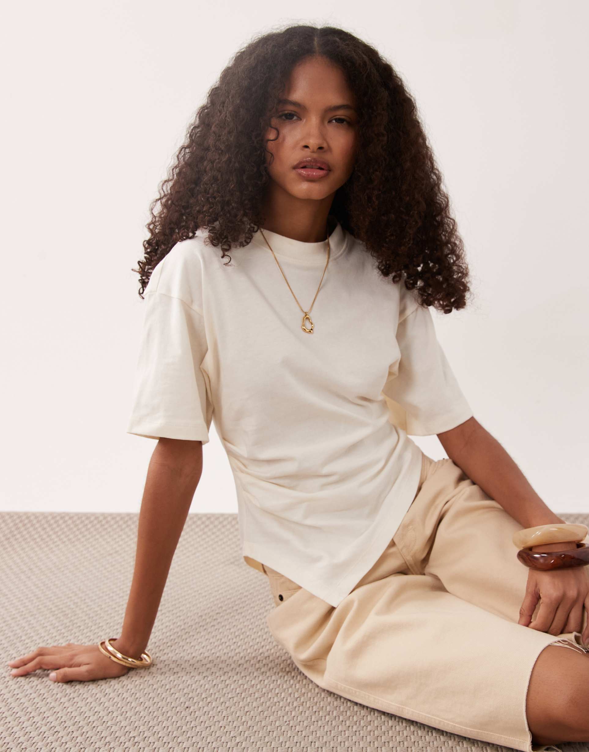 asos design short sleeve with asymmetric hem top in yellow