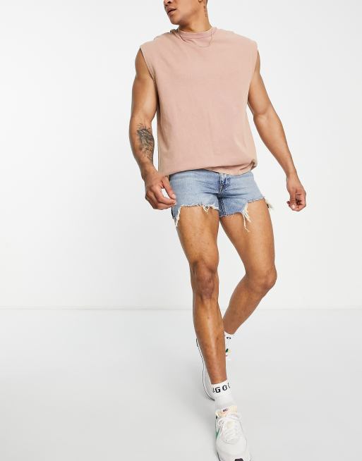 ASOS DESIGN shorter length denim shorts in 90s mid wash with rip