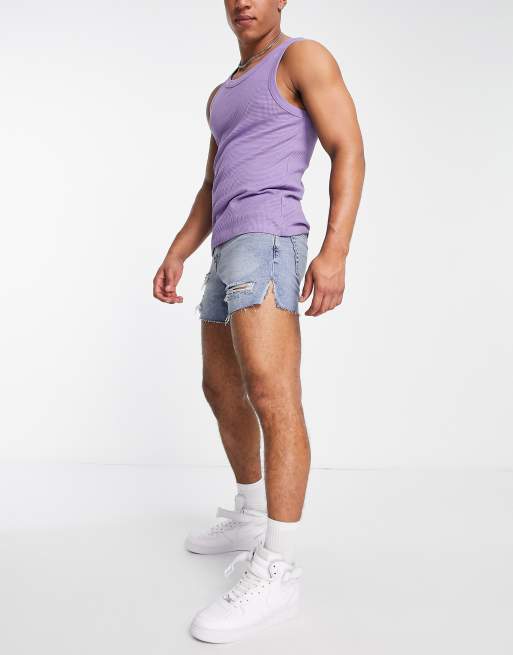 ASOS DESIGN shorter length denim shorts in 90s mid wash with rip detail and  raw hem