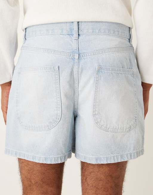 ASOS DESIGN shorter length denim shorts with pleats in bleach wash