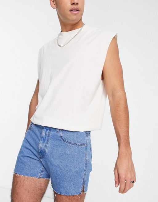 ASOS DESIGN shorter length denim shorts with rainbow print