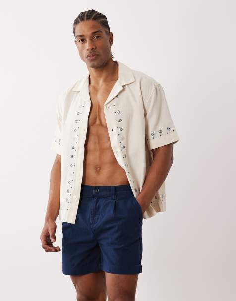 ASOS DESIGN shorter length shorts in navy with pleat - view 1