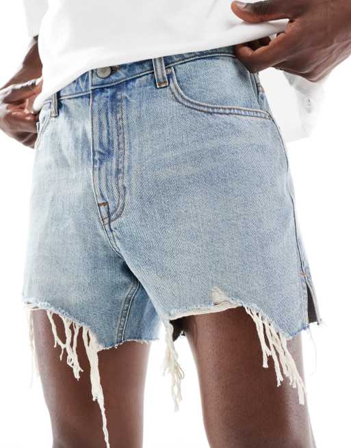 ASOS DESIGN shorter length slim denim shorts in light wash blue with rip detail, 2 of 5