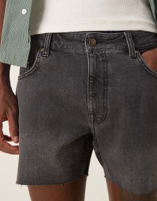ASOS DESIGN shorter length slim denim shorts with rip detail in black