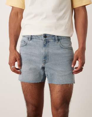 ASOS DESIGN shorter length slim denim shorts with rip detail in light wash blue