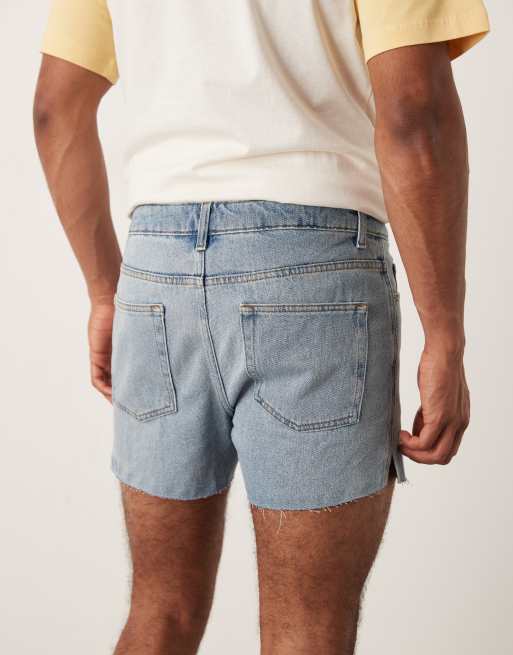 ASOS DESIGN shorter length slim denim shorts with rip detail in light wash blue, 3 of 5