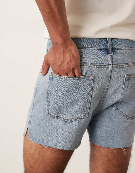 ASOS DESIGN shorter length slim denim shorts with rip detail in light wash blue, 4 of 5