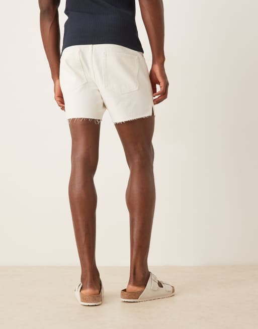 ASOS DESIGN shorter length slim denim shorts with rip detail in white, 4 of 5