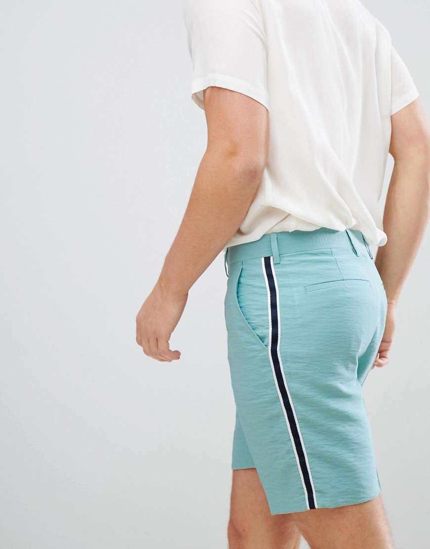 ASOS DESIGN shorter length smart shorts in green linen look with side stripe