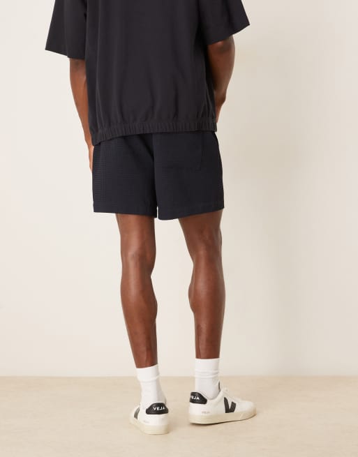 ASOS DESIGN shorter length waffle shorts in navy