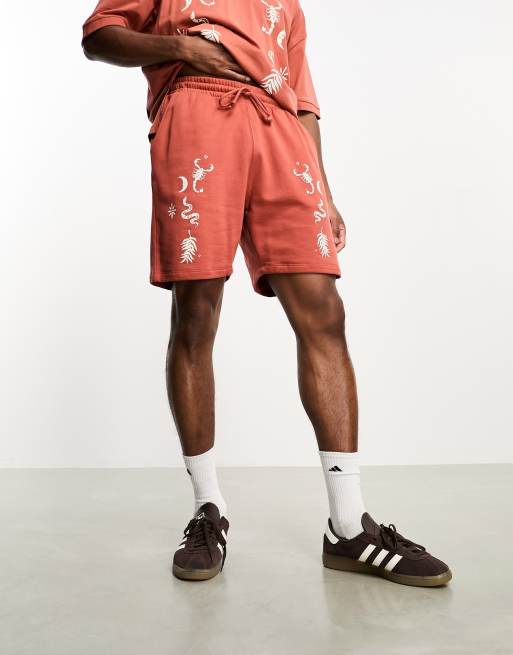 ASOS DESIGN shorts in burnt orange with celestial print - part of a set