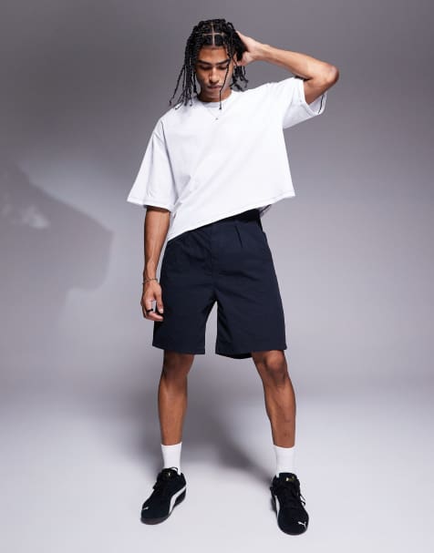 ASOS DESIGN – Shorts in Marineblau in mittlerer Länge mit Bundfalten - view 1