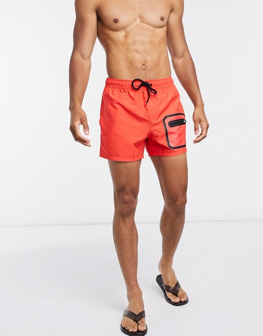 ASOS DESIGN swim shorts in red with heat seal pocket short length