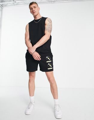 ASOS DESIGN shorts with Ibiza Amnesia print in black