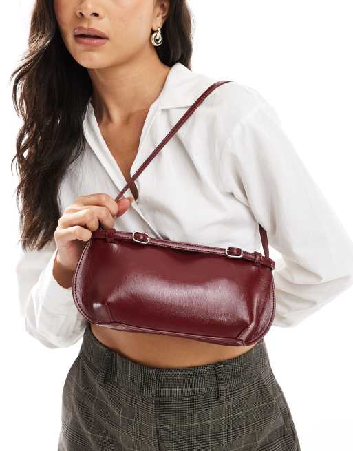 ASOS DESIGN shoulder bag with buckle detail in burgundy