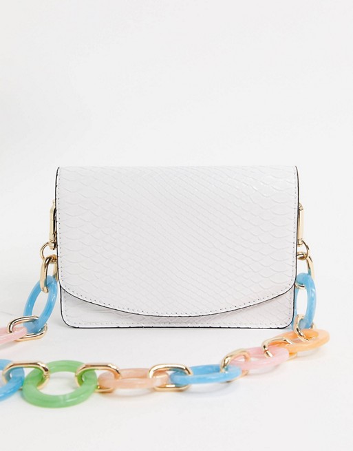 ASOS DESIGN shoulder bag with statement chain in white snake
